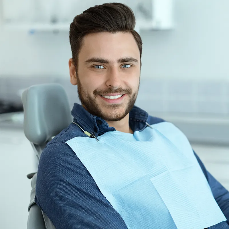 cosmetic treatment happy patient in dental clinic