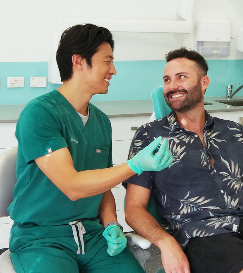 dental paradiso our team dentist and patient in dental clinic